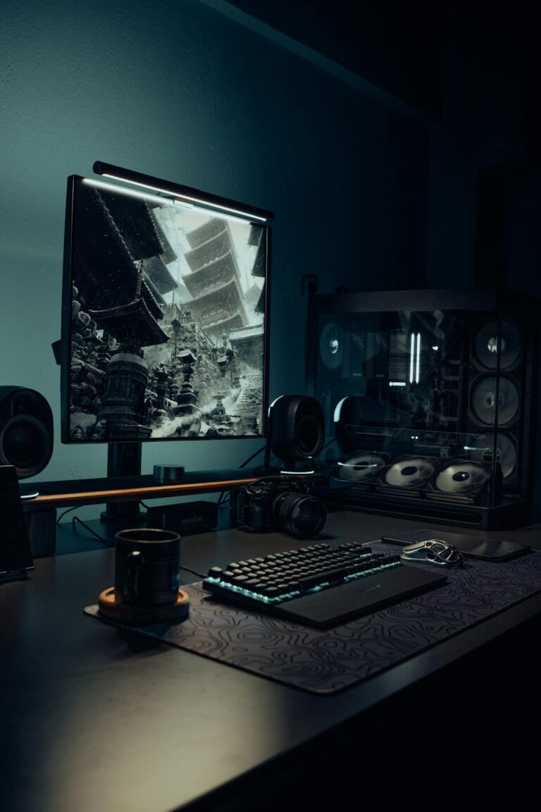 Stylish gaming setup featuring a PC, keyboard, and Asian theme on monitor screen.